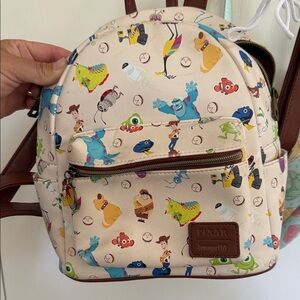 Loungefly Cream Backpack with Multicolor Characters